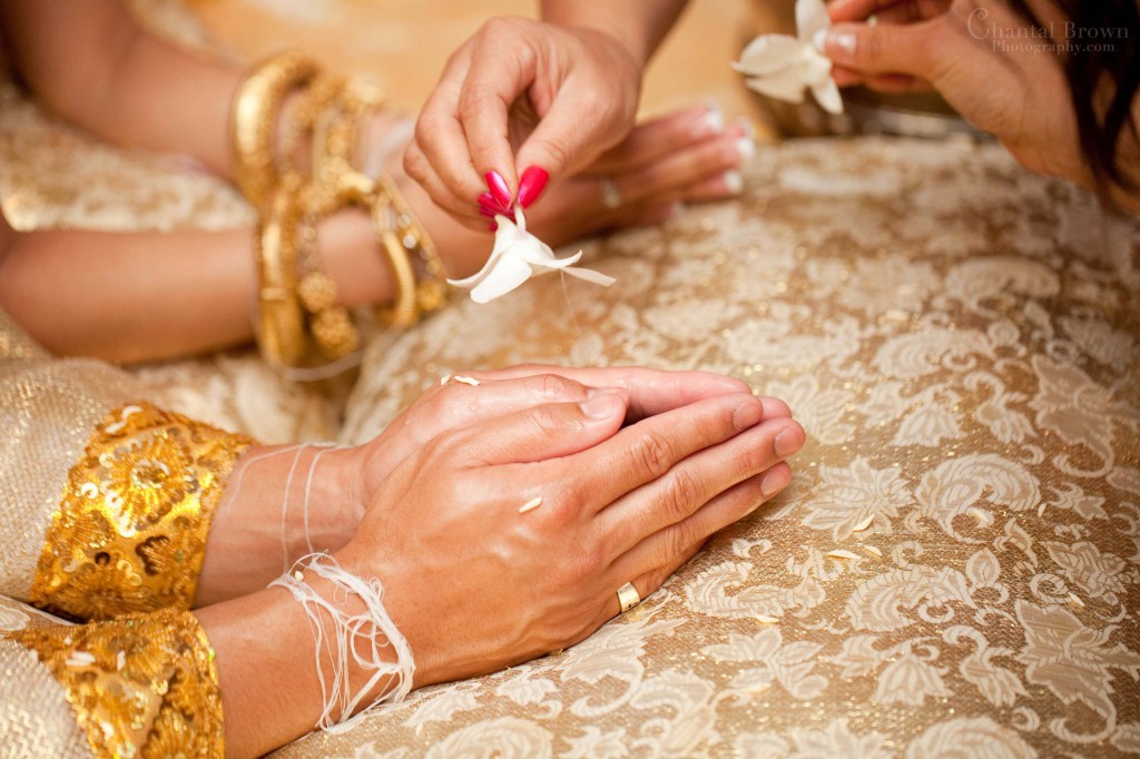 Spirital water sprinkle on groom and bride by guest for well wishes Cambodian Khmer ceremony in Dallas Spirital water sprinkle on groom and bride by guest for well wishes Cambodian Khmer ceremony in Dallas