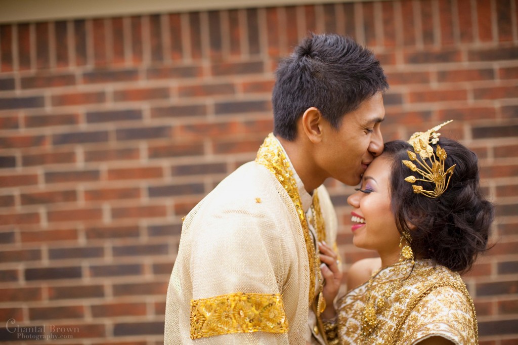 Bride and Groom kissing in beautiful golden Khmer outfits in Dallas Bride and Groom kissing in beautiful golden Khmer outfits in Dallas