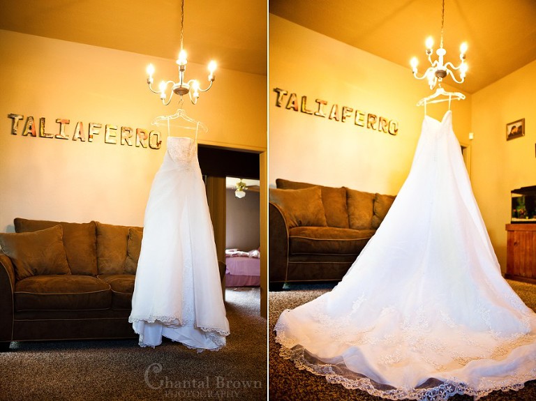 wedding dress hanging from chandeliers at grey stone chapel lawton wedding photographer