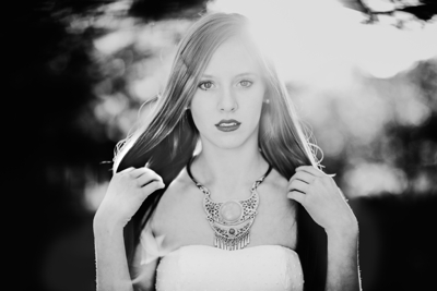 Black and white picture of Allen Texas High School Senior Portraits with sun flare and raves