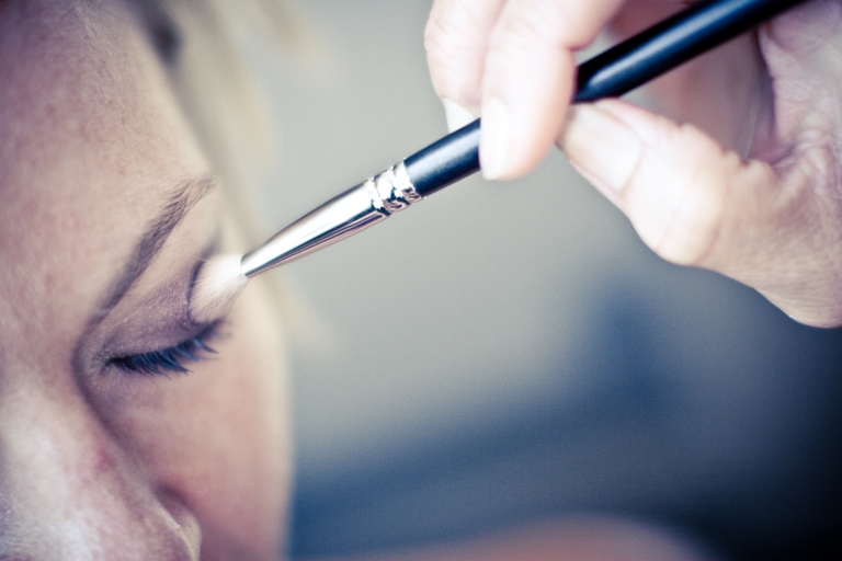 Putting make up on wedding at Frisco Texas