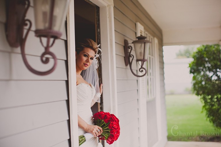Bride outside holding rose boutique at Southfork Ranch wedding in Parker TX