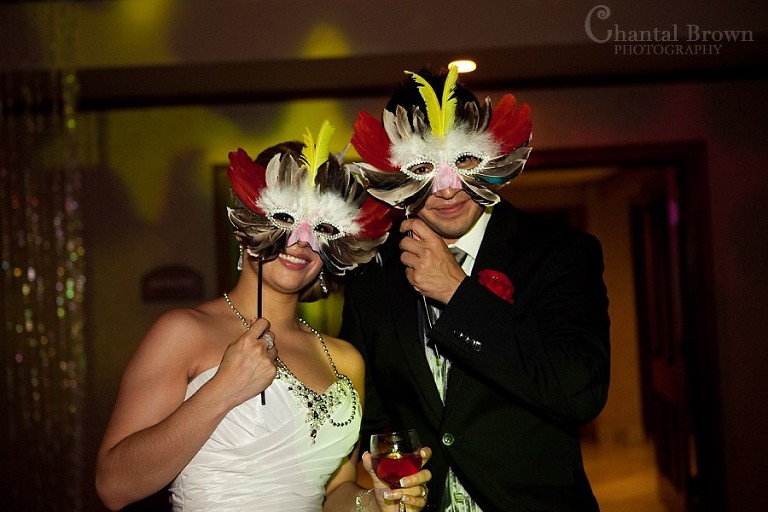 Bride and groom wearing masks at at Southfork Ranch wedding in Parker TX