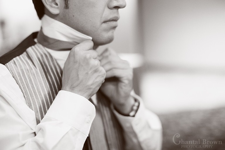 Groom getting ready at Southfork Ranch wedding in Parker TX