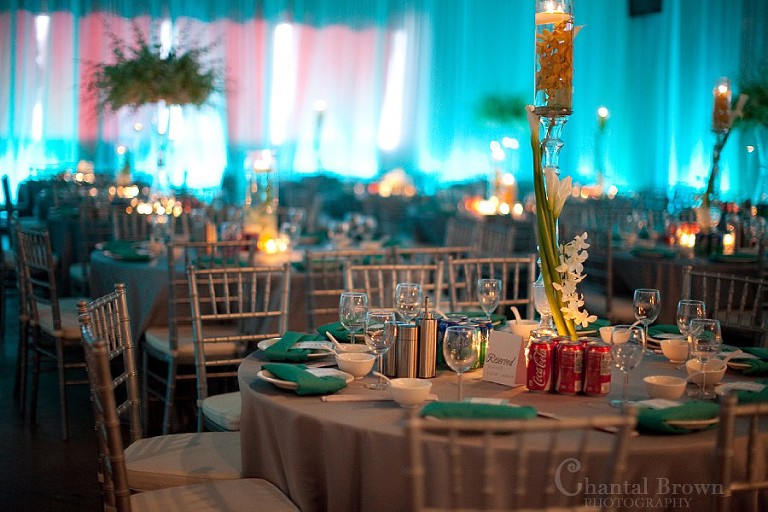 Dallas wedding reception beautiful detailed white calla lily flower centerpieces with blue background light
