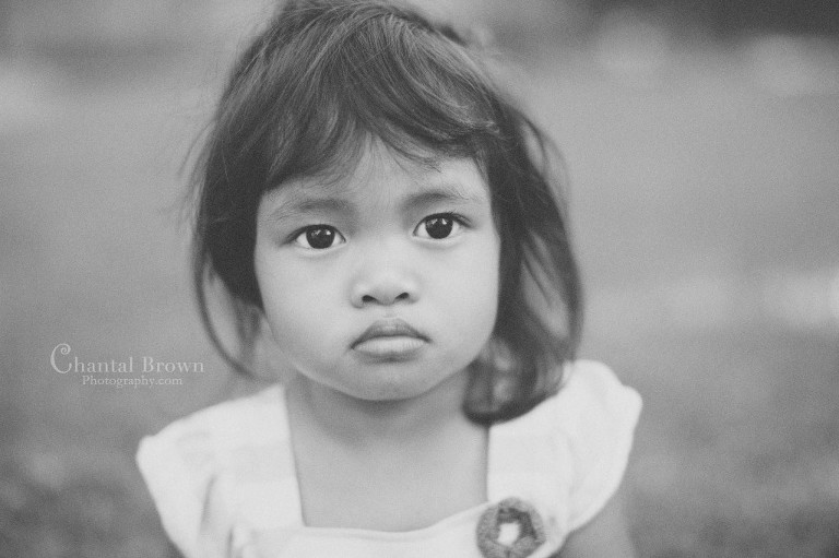 black and white baby portrait at the park