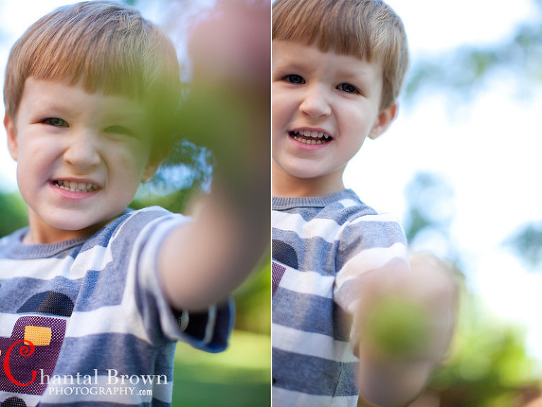 baby looking at camera laughing portrait