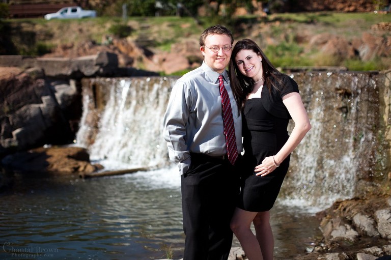 lovebird lawyer-standing-by-lovely-waterfall-medicine-park-lawton-engagement-photographer