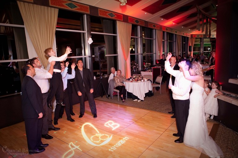 groom tossing girdle to all single men at Dallas Westin Park Central hotel