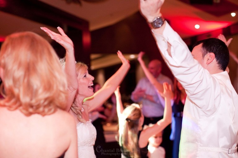 bride groom friends having fund dancing to wedding music