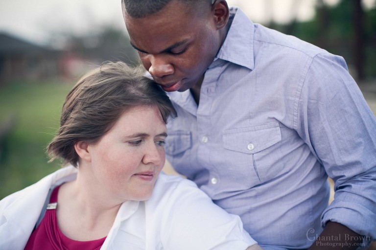 Fiance kissing fiancee on head close up engagement portrait in Lawton Medicine Park