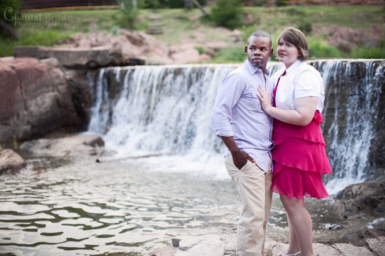 Gorgeous engagement couple standing by beautiful waterfall in Medicine Park in Lawton Oklahoma portrait photography