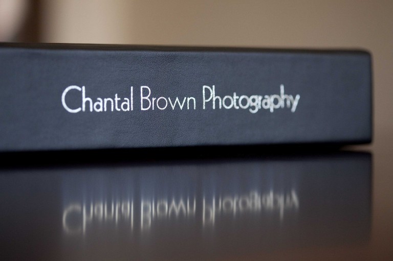 Fine black leather flush mount wedding album with imprinting name on bind in Dallas