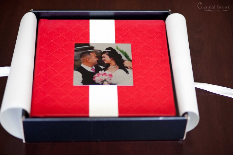 Red printed leather flush mount wedding album in beautiful box Dallas Texas with white sheets and ribbons