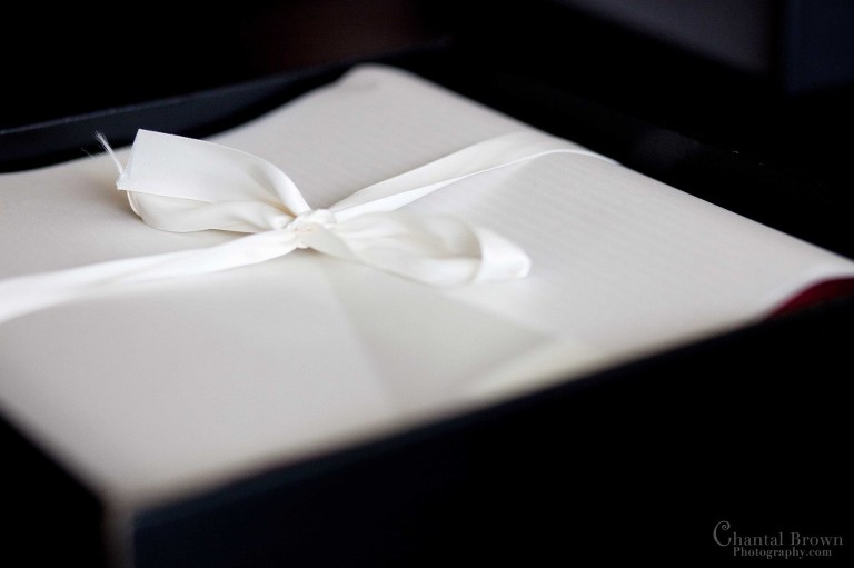 Wedding album box with beautiful white sheets and ribbon tie in a bow