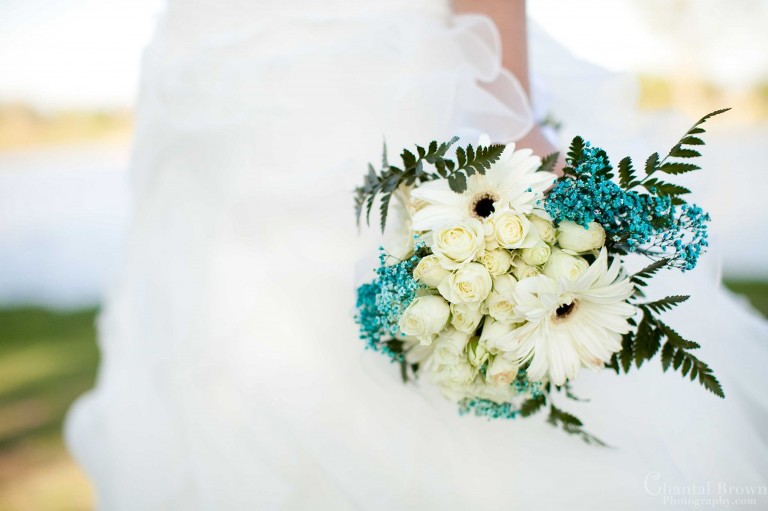 bride holding white and blue flowers bouquet at lawton country club golf course on Gore st Oklahoma