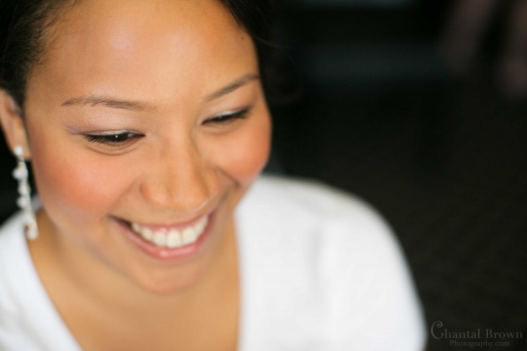 happy bride smiling getting ready wedding Lawton Country Club