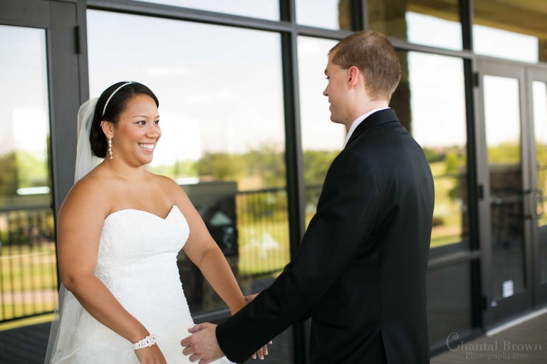 groom very happy to see bride first look time in Lawton Country Club golf course on balcony in Oklahoma
