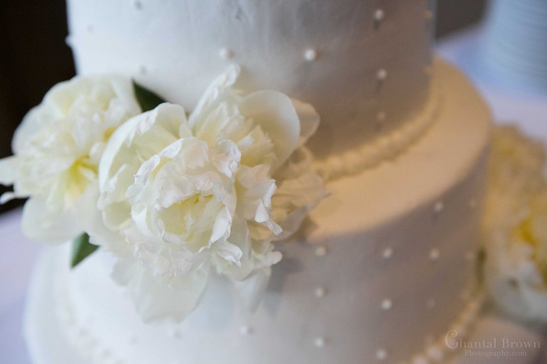 white beautiful wedding cake white peonies flowers and pearls in Lawton Country Club Golf Course Oklahoma