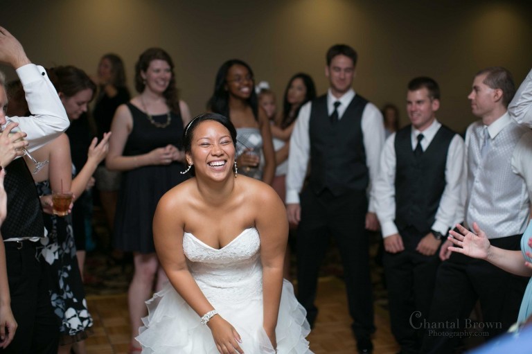 bride having fun center of dance floor in Lawton Country Club Golf Course wedding Oklahoma