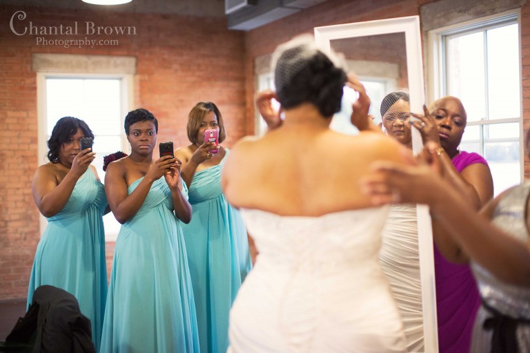 bridesmaid baby blue wedding dress watching bride getting ready at Dallas Filter Building