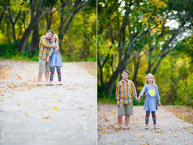 Brother and Sister hugging on sidewak beautiful fall leaves colors children portrait photography at Breckinridge Park in Richardson Texas