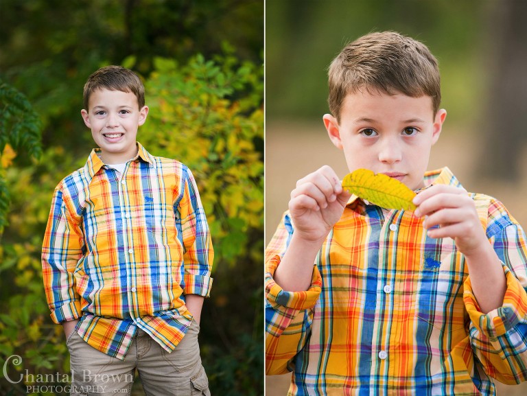 Children portrait photography at Breckinridge Park in Richardson holding yellow fall leaves and smiling