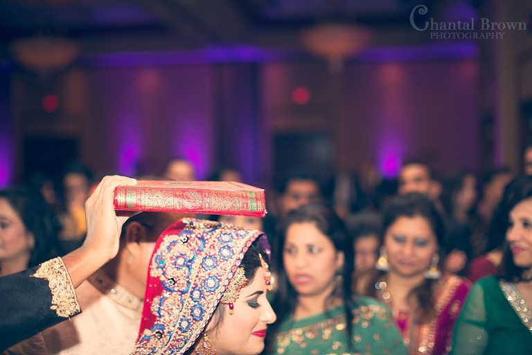 Indian wedding ceremony sacred book above bride's head crying leaving ceremony reception at Marriott Renaissance hotel in Richardson Texas