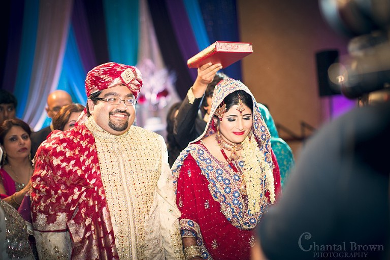 Indian wedding ceremony sacred book above bride's head crying leaving ceremony reception at Marriott Renaissance hotel in Richardson Texas