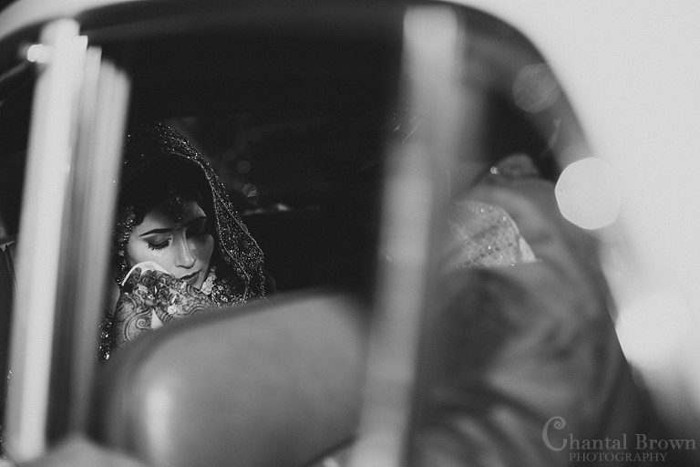 Indian wedding bride crying black and white picture in white Roll Royce car at Marriott Renaissance hotel in Richardson Texas