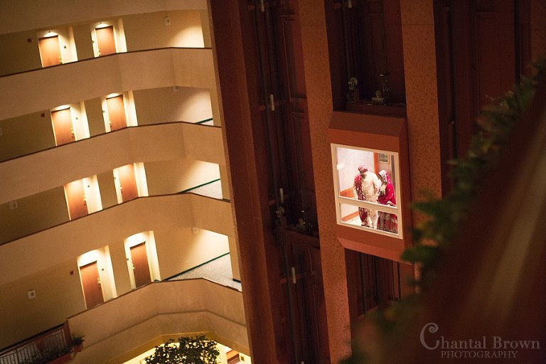 Indian wedding couple portrait in Marriott Renaissance hotel lobby elevator in Richardson Texas