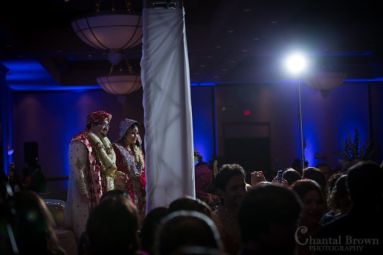 Bride and groom entering Indian wedding ceremony at Marriott Renaissance hotel in Richardson Texas