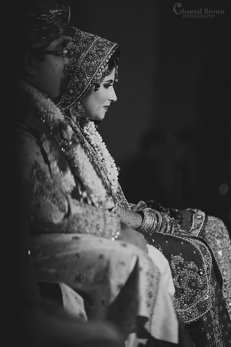 Indian wedding black and white picture with bride wearing red sari and lei at Marriott Renaissance hotel in Richardson Texas