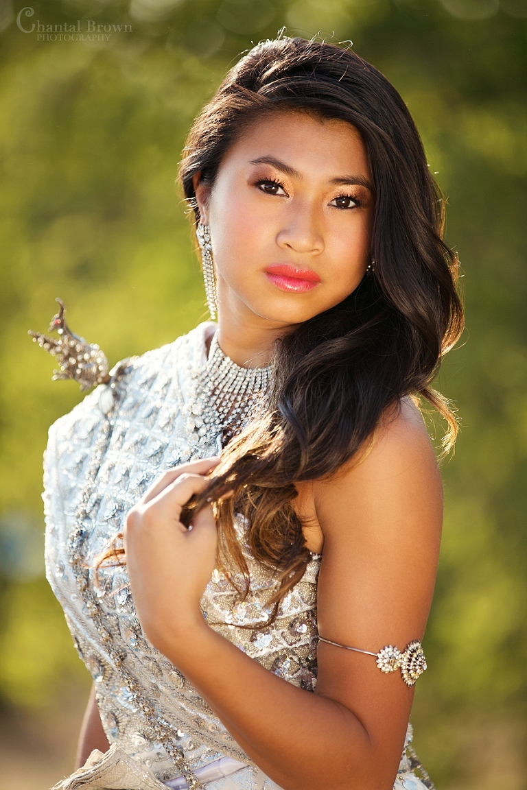 Dallas senior portrait wearing traditional Khmer Cambodian white silver dress at Arbor Hills Nature Preserve Park in Plano Texas golden sunset