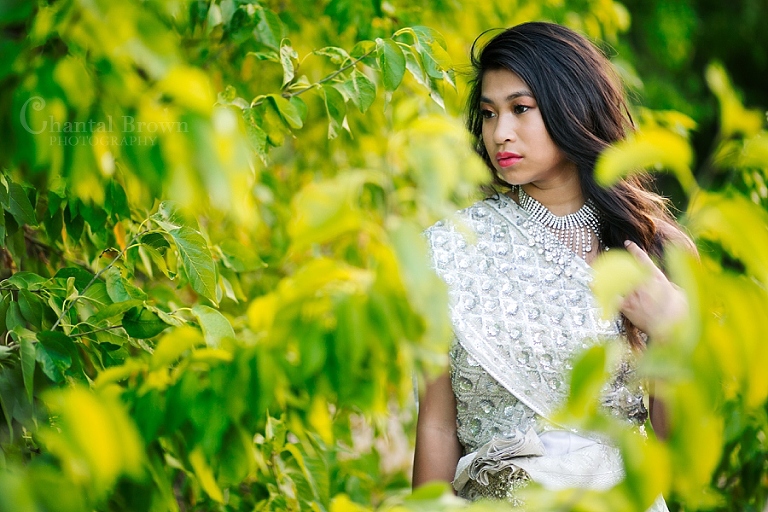 Dallas senior portrait wearing traditional Khmer Cambodian white silver dress at Arbor Hills Nature Preserve Park in Plano Texas