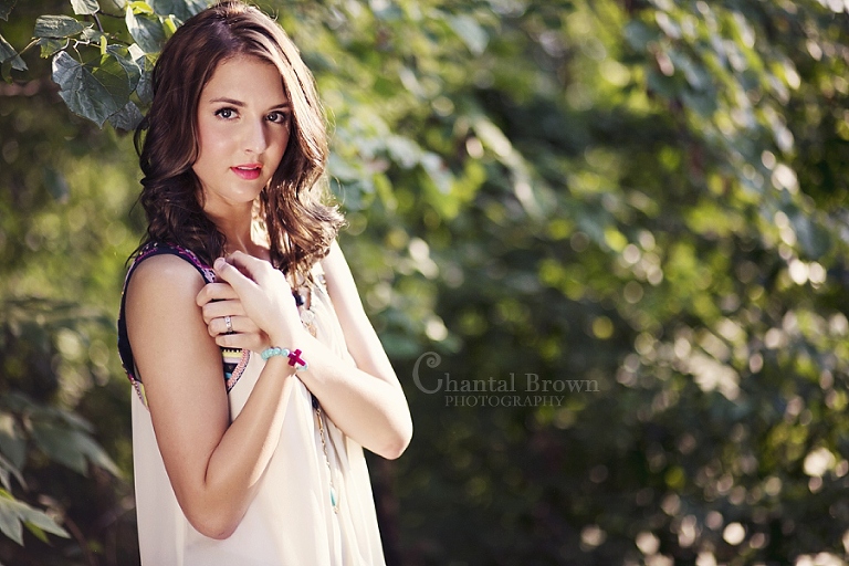 gorgeous senior plano portrait photographer in open sun at a park