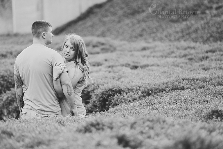 Downtown Dallas Engagement Session by Art District in grass field black and white photo