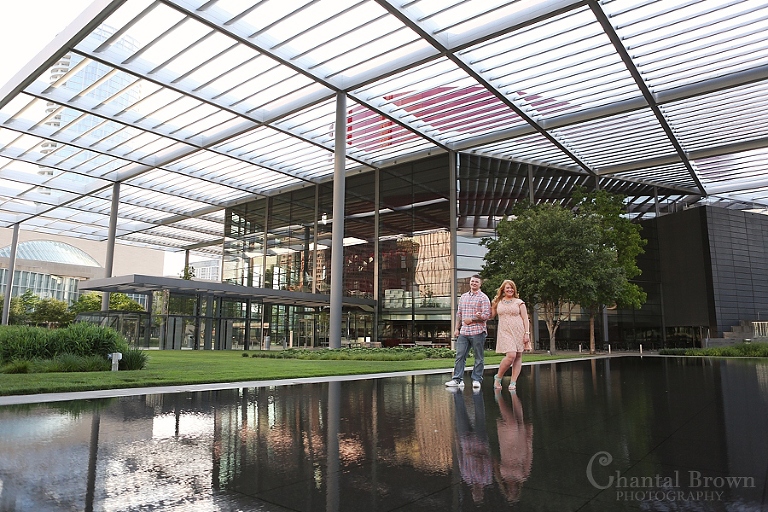 Downtown Dallas Engagement at Opera Windspear by water pond