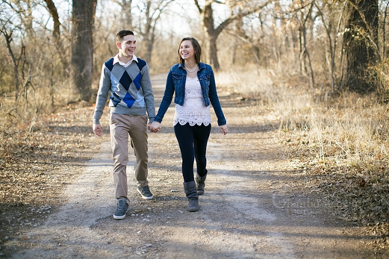 Lawton engagement sun flare pictures in the forest by dried tree trunk in fort sill forest by Chantal Brown Photography