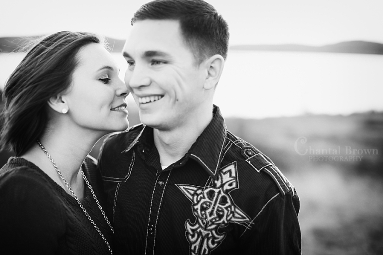black and white picture of Lawton Oklahoma engagement pictures smiling at Lake Elmer Thomas Recreation by Chantal Brown Photography