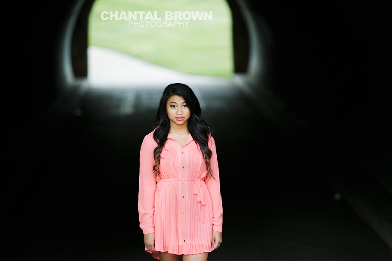 Carrollton TX Creekview High School Senior Portraits by Chantal Brown Photography taken in McKinney Texas at Adriatica standing inside a tunnel.