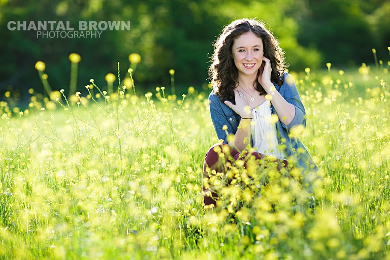 Allen High School student of Lucas Christian Academy of Allen Texas senior portraits is taken in Dallas beautiful yellow flower field in the sun by Chantal Brown Photography