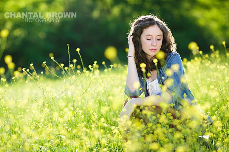 High School student of Lucas Christian Academy of Allen Texas senior portraits is taken in Dallas beautiful yellow flower field in the sun by Chantal Brown Photography