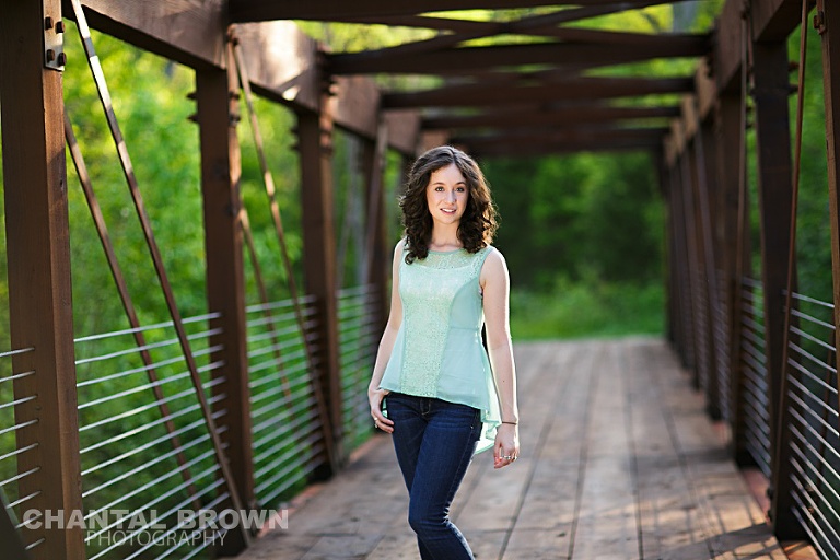Dallas senior outdoor senior portrait photographer Lucas Christian Academy of Allen TX student setting on a bridge taken by Chantal Brown Photography