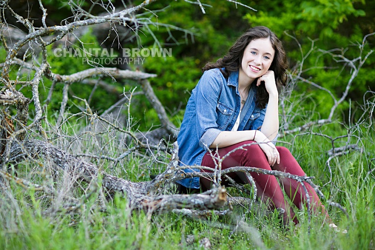 Dallas senior portrait photographer of Lucas Christian Academy senior student setting on a branch in Dallas taken by Chantal Brown Photography