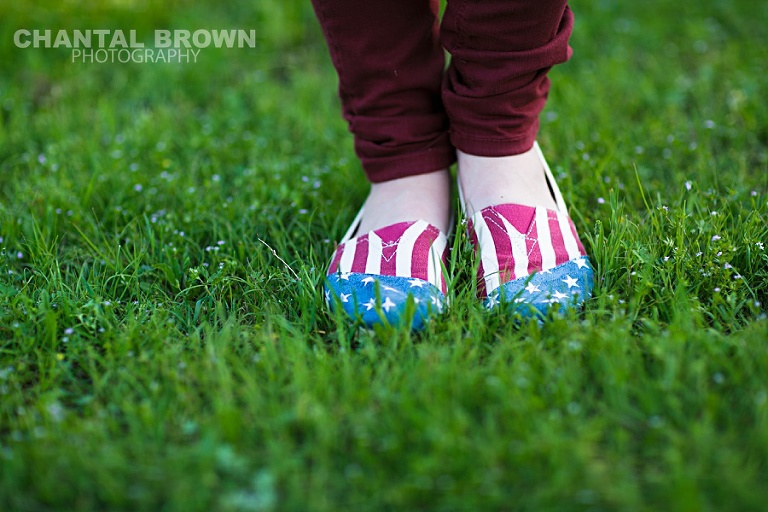 Dallas senior portraits of high school senior student of Lucas Christian Academy in Allen Texas is wearing American flag Toms shoes