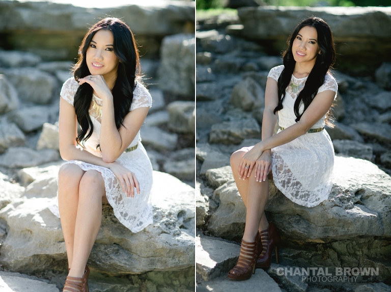 Stunning college graduation pictures taken at Prairie Creek Park in Richardson Texas setting on rocks by the waterfall taken by Chantal Brown