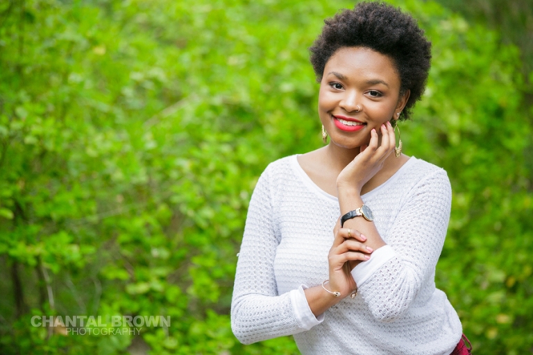 Outdoor Red Oak High School senior pictures at Highland Park in Dallas Texas smiling in gorgeous red lipsticks