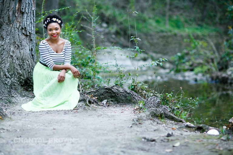 Outdoor Red Oak High School senior portraits at Highland Park in Dallas Texas by water creeks and big tall trees with gorgeous flower head band.