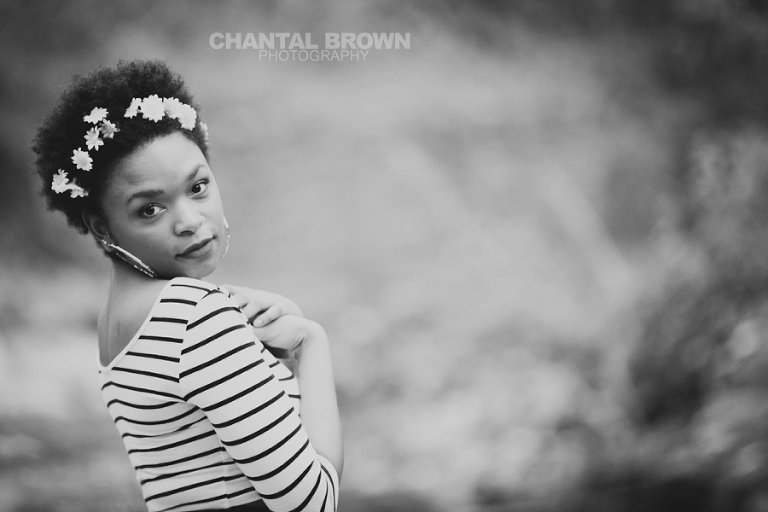 Outdoor Red Oak High School senior portraits at Highland Park in Dallas Texas by water creeks smiling in black and white photo
